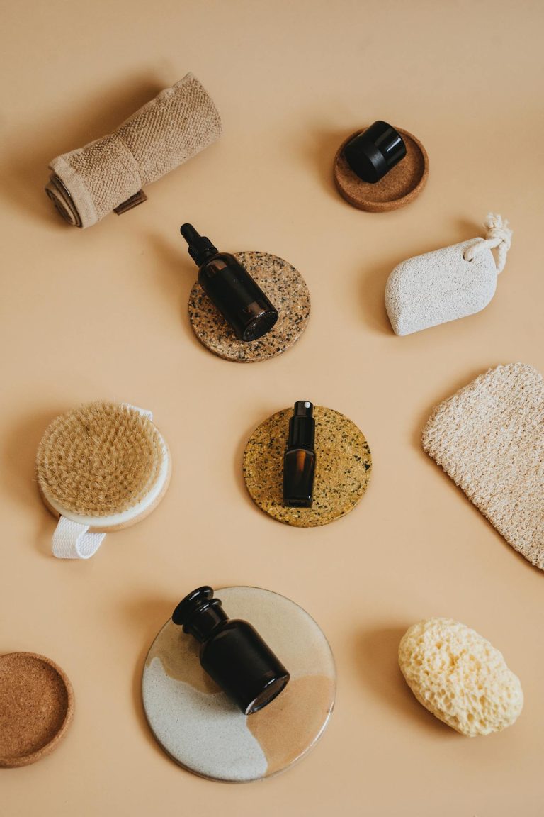 Flat lay of eco-friendly bathing essentials on beige surface, perfect for wellness lifestyle themes.